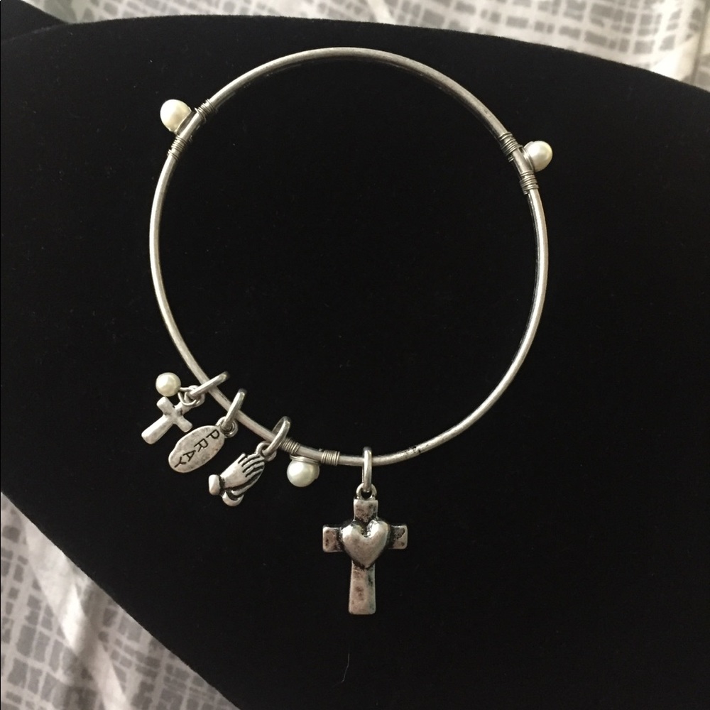 Pray cross necklace.